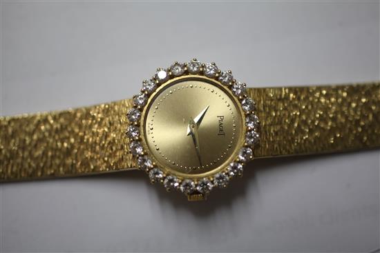 A ladys 1980s 18ct gold and diamond Piaget manual wind wrist watch, with Piaget box.